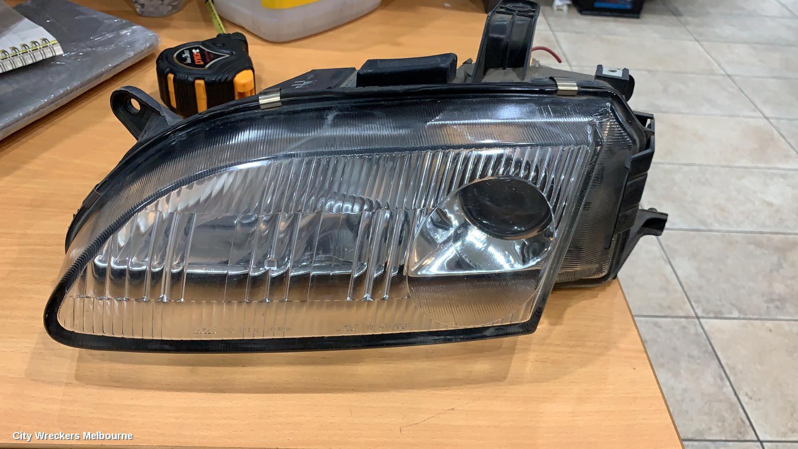 MAZDA ASTINA 1997 Left Headlamp